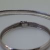 Afbeelding van WITGOUDEN ARMBAND EN HALSSNOER